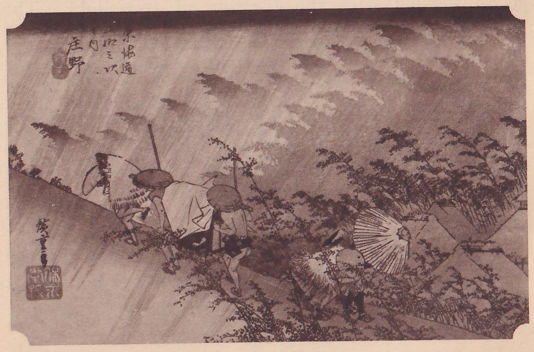 Print of a heavy rainstorm over a hillside: slanting rain streaks and dark cloud shapes fill the sky. At the left a group of figures in straw capes and round hats hurry along the slope, one holding a pole. At the lower right bent figures struggle against the wind beside a large open umbrella, with bushes and thatched roofs at the right. Title writing is at the upper left, a signature and seal at the lower left.