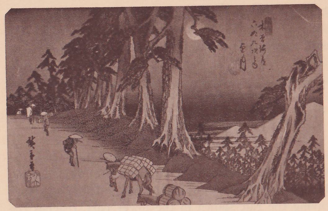 Print of a road through tall pines at night: massive pine trunks with pale bark rise at the upper center, a pale moon shows through the branches at the upper right, and a bare road runs back along the left. In the foreground a person in a wide round hat leads a horse carrying a checkered bundle, round objects lie stacked at the lower edge, and a person in a wide round hat with a staff walks farther back. Smaller figures stand far off at the left, and a leaning bare trunk and a pale mountain are at the right. Title writing is at the upper right and a signature and seal at the lower left.