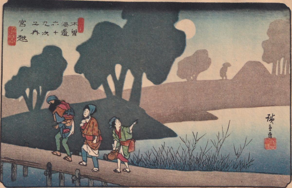 Colored print of a moonlit riverside: large dark rounded trees stand on a low hill, a pale round moon shows at the upper right, and people walk in a line along a plank walkway at the lower left, the one at the right pointing upward with one arm. Reeds grow along the water's edge at the right, and a small dark figure in a hat stands far off on a hill. Red seals and title writing are at the upper left, and a signature and seal are at the right.