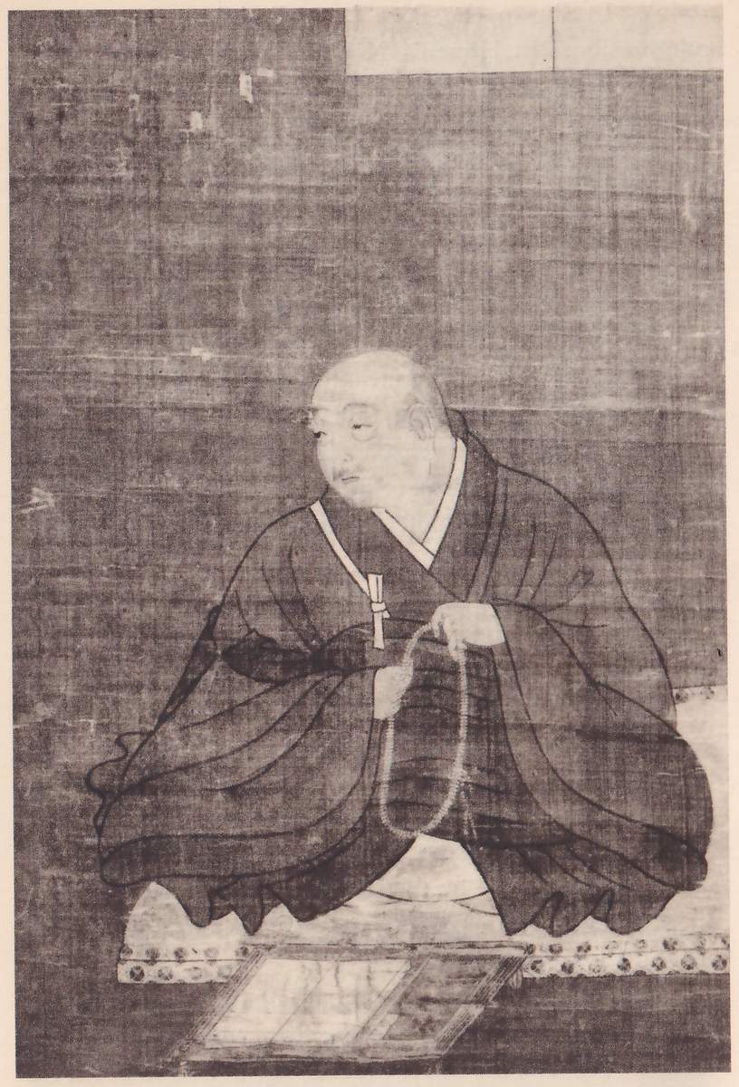 Faded painting of a seated bald man in dark robes with a white collar, his body and head turned toward the viewer's left, a looped string of beads hanging from the hand held at his chest; a pale rectangle lies on the floor before him.