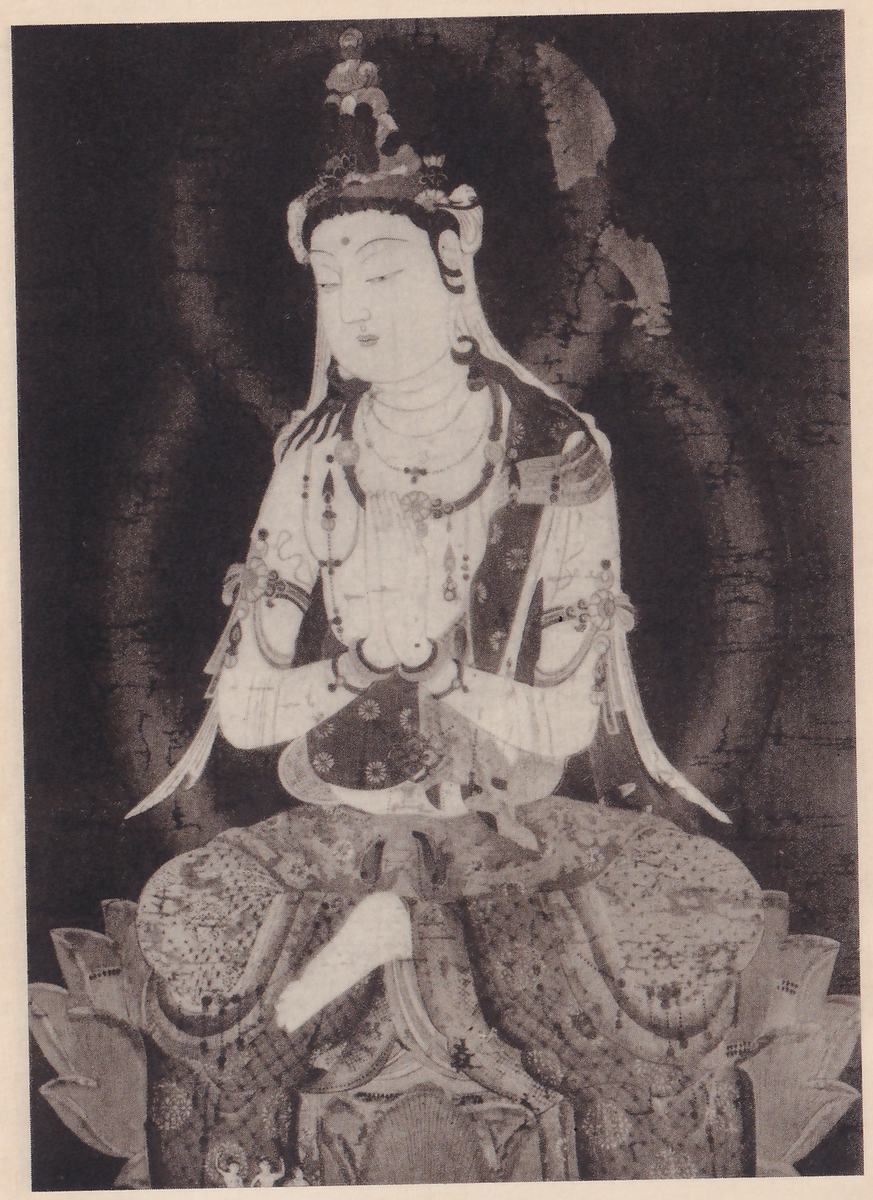 Painting of a seated figure with a tall ornate crown and a high topknot, a jeweled necklace and bracelets, and long pale robes and veils, seated on a large lotus cushion on a dark ground.