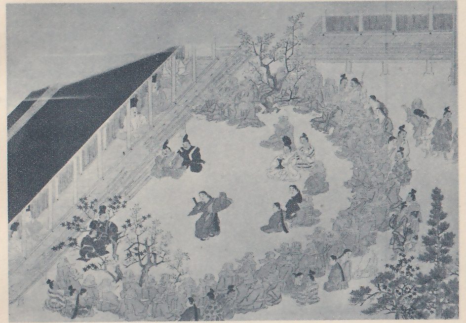 Painting, seen from above, of a gathering in a courtyard in front of a long building with a dark roof and a veranda at the left. One person in a long robe stands in the open space at the center with one arm raised, and many seated people in robes fill the ground around its edge, in rows along the right and bottom and in small groups near the center. Bare and leafy trees and a pine stand among them, and a building with slatted panels shows at the upper right.