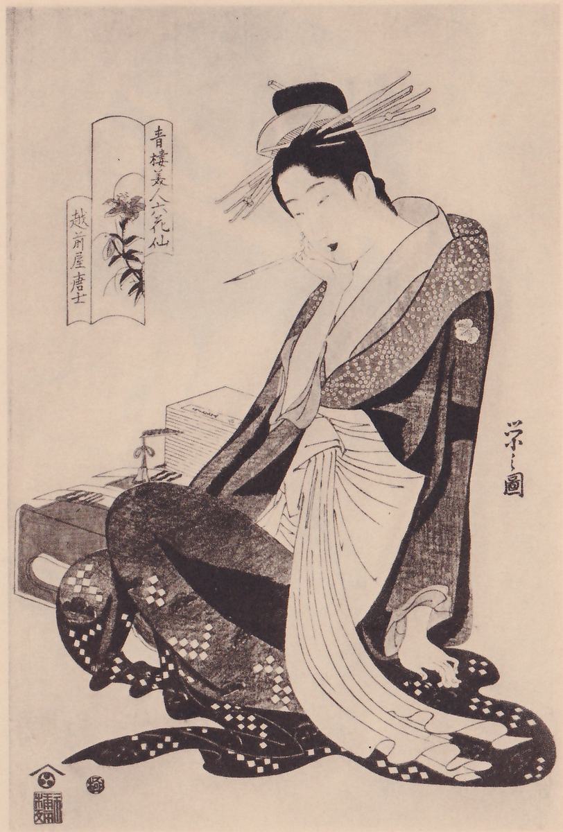 Black-and-white print of a seated figure turned three-quarters to the left, the head resting on one hand with a thin pale stick held at the lips. The hair is in a high knot with many long pins fanning out. The robe is dark with a dotted collar, a long pale sash hangs down the front, and a checked pattern runs along the hem. At the left a stack of flat pale pieces stands on a low box. A frame with a flower and columns of Japanese characters stands at the upper left, a signature column at the right, and seals at the lower left.