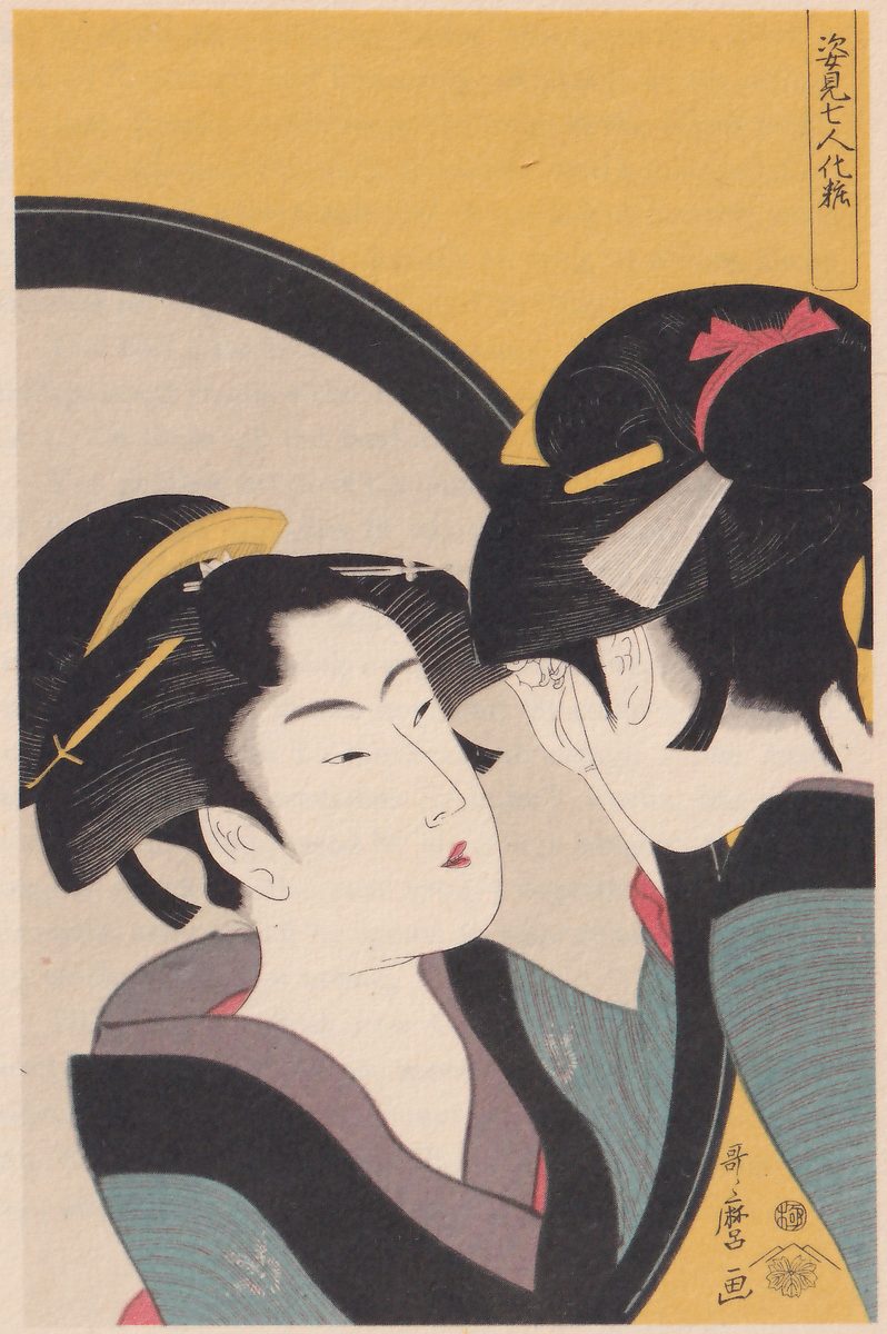 Colour print of two heads close together. At the left a face seen nearly from the front, turned slightly to the right, has black hair piled up and held with a yellow comb and a yellow pin, above a robe with a black collar and a mauve collar and a blue-green sleeve. At the right a head turned away shows black hair with a red ribbon and a white tassel, one hand raised to the cheek, and a blue-green sleeve. A large pale round shape with a thick black rim curves behind them, and a flat yellow ground fills the top. A column of Japanese characters in a narrow frame stands at the upper right, and a signature column with seals at the lower right.