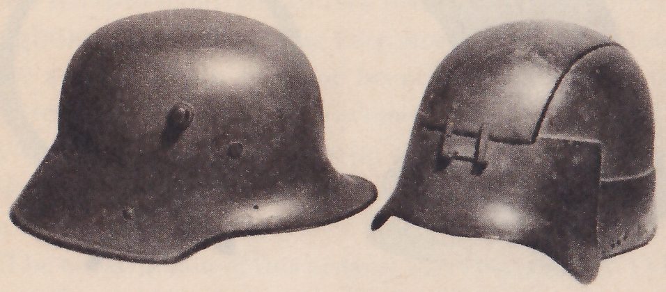 Black-and-white photograph of two smooth dark domed helmets side by side, each with a wide flared lower edge. The one at the left has a small knob on its side and a few round dots. The one at the right has a curved seam over its top and a flat rectangular plate on its side with two small upright fittings.
