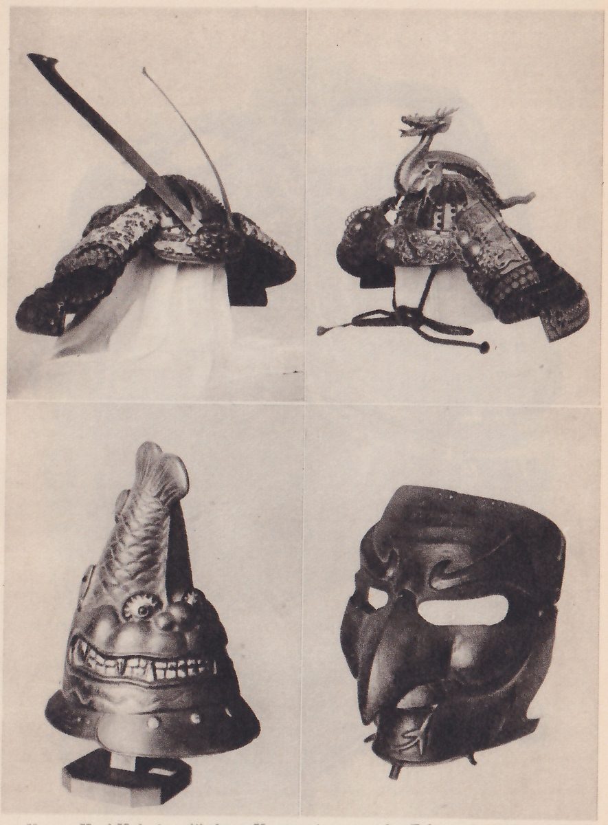 Four black-and-white photographs in two rows of two. Upper left: a helmet with broad ornate flaps at its sides, a long thin straight pole slanting up to the upper left from its top and a thin curved line beside the pole, with a pale hanging shape below. Upper right: a helmet with ornate flaps at its sides and a small head and neck with an open mouth rising from its top, with cords and two small round-ended tassels hanging below. Lower left: a bell-shaped helmet topped with a tall ridged curve that has two lobes at its tip, a rounded face below it with a large round eye and a wide mouth showing a row of teeth, a wide studded rim, and a small block under it. Lower right: a dark mask with a long curved nose, a wide oval opening above it, a flared brow and small points along its lower edge.