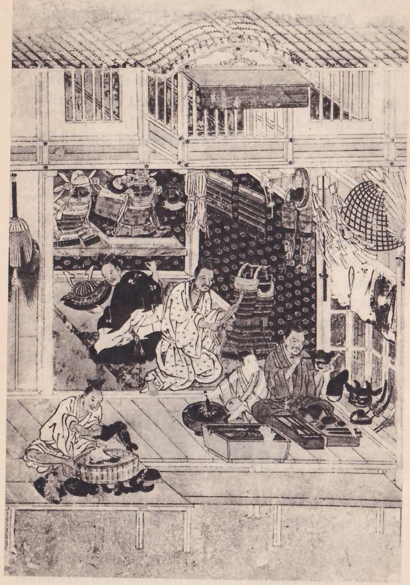 Black-and-white reproduction of a painted scene of a house open at the front, with a raised floor, a roof drawn in parallel lines along the top and an upper floor with latticed windows. Along the back, armour sits on a shelf at the left, armour hangs against a patterned wall at the center, and a round net-like shape hangs at the right. Figures in loose robes sit on the floor in front, some near the center and one at the lower left bent over a wide shallow tub; at the right a figure works at a low box with tools, with helmets on the floor beside it.