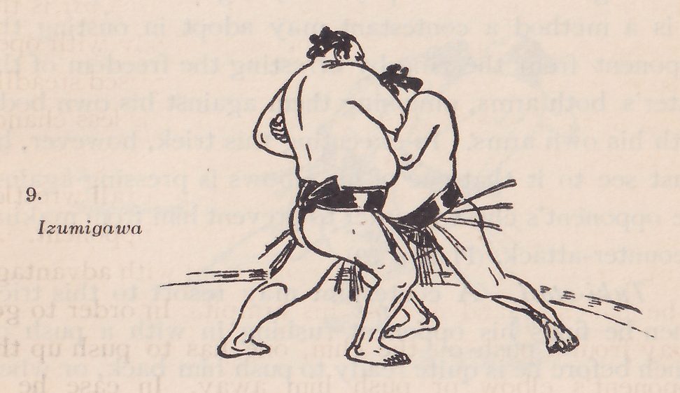 Line drawing of two wrestlers, each in a dark belt with an apron of hanging strands. The two men are pressed close together at the center, bent forward, their arms wrapped around one another and their heads side by side at the top, with a dark belt at the waist of the nearer man. Their feet are spread wide on the ground, and a line of dashes crosses the ground at the lower right. Printed beside the drawing: 9. Izumigawa