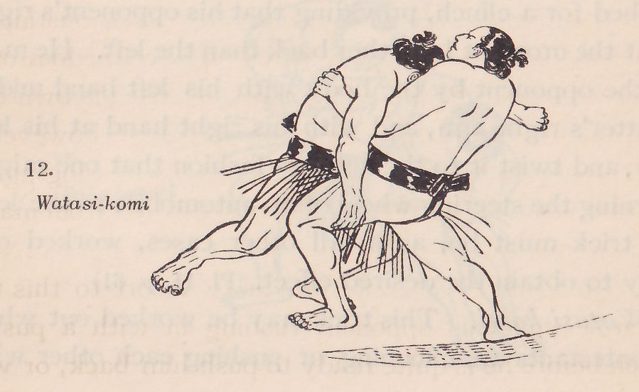 Line drawing of two wrestlers, each in a dark belt with an apron of hanging strands. The two men are bent forward and pressed together at the center, a dark belt at the waist of the nearer man and their heads side by side at the top. Their legs are spread wide, one foot at the lower left, and a line of dashes marks the ground at the bottom. Printed beside the drawing: 12. Watasi-komi